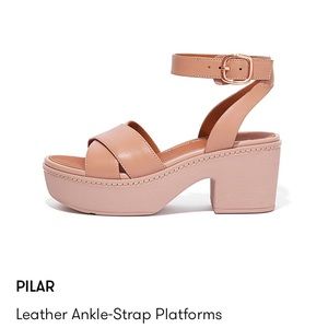 Beige ankle strap platform sandals. Never been worn, run a little big.